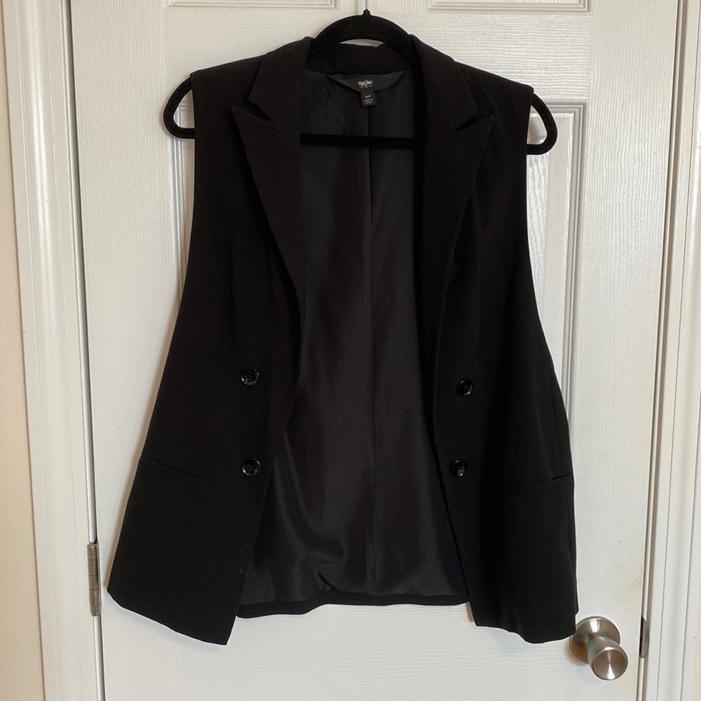 Black, stylish vest. Never worn.
